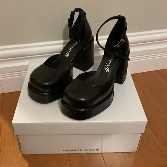 Platform square toe angle strap chunky heels in black from Intervalle